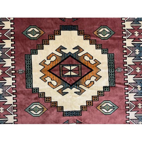 117 - A Turkish Loki rug, with vibrant geometric panelled field, in tones of red, russet, orange, cream, t... 
