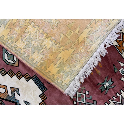 117 - A Turkish Loki rug, with vibrant geometric panelled field, in tones of red, russet, orange, cream, t... 