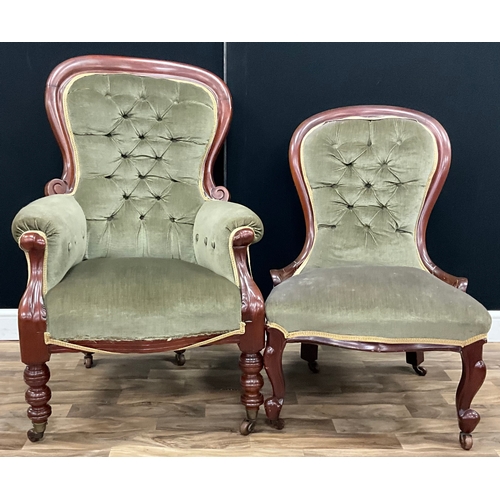 118 - A Victorian style mahogany spoonback armchair, green button-back upholstery, turned legs on casters,... 