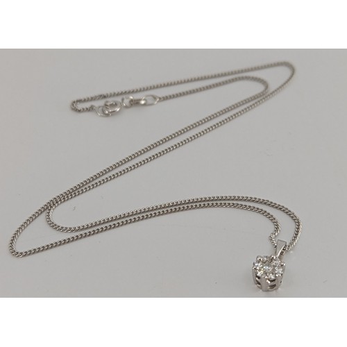 305 - An 18ct white gold diamond cluster pendant with 18ct white gold fine curb link chain and a spare 18c... 