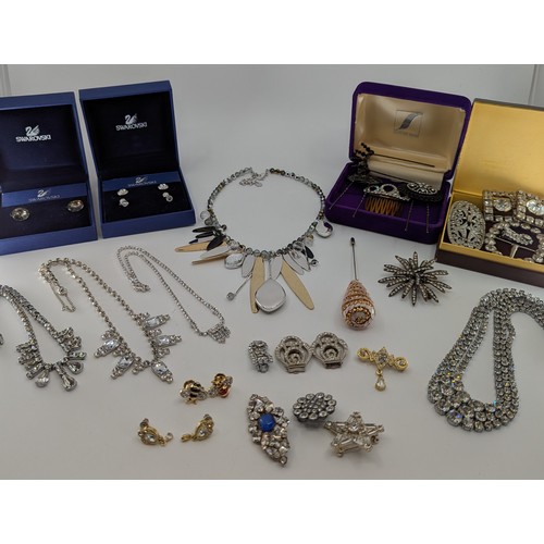 306 - A selection of costume jewellery;
to include a pair of swarovski crystal stud earrings boxed, a swar... 