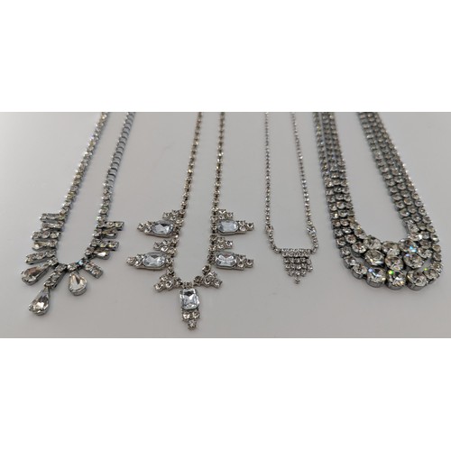 306 - A selection of costume jewellery;
to include a pair of swarovski crystal stud earrings boxed, a swar... 