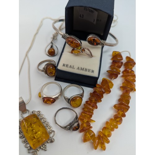 311 - A selection of amber jewellery, 
to include a 