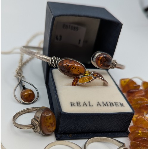 311 - A selection of amber jewellery, 
to include a 