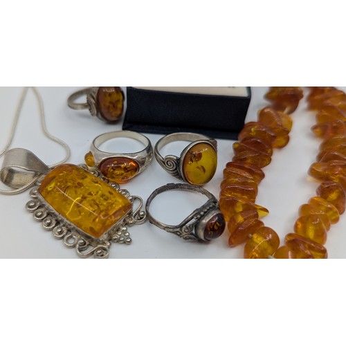 311 - A selection of amber jewellery, 
to include a 