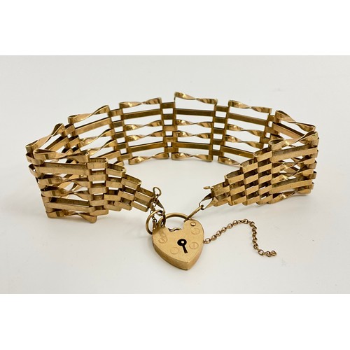 335 - A 9ct gold gate link bracelet, 
approx. 2cms max width, hallmarked 