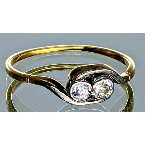 338 - A tested 18ct gold two stone diamond crossover design ring,
set with two melee old european cut diam... 