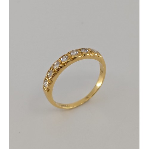 339 - An 18ct gold diamond half eternity ring, 
set with seven approx. 0.05ct round brilliant cut diamonds... 