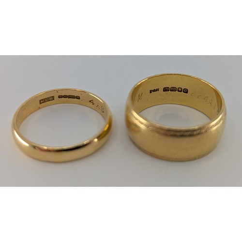 344 - Two 18ct gold wedding bands, 
one of them is approx. 7mm wide, stamped 