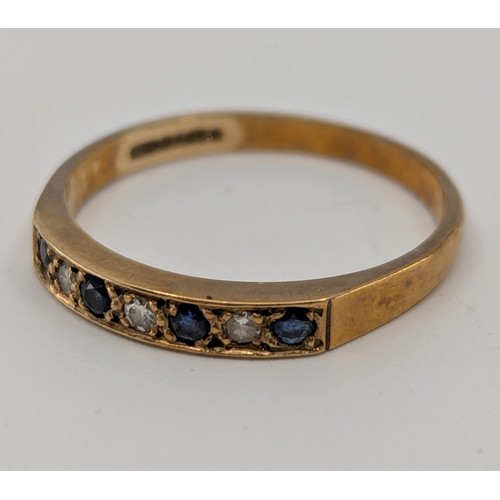 354 - A 9ct gold seven stone sapphire and diamond eternity ring, 
set with four approx. 0.02ct round brill... 