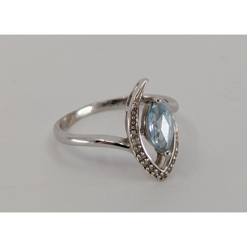 357 - A 9ct white gold aquamarine and diamond dress ring,
set with an approx. 0.40ct marquise cut light bl... 