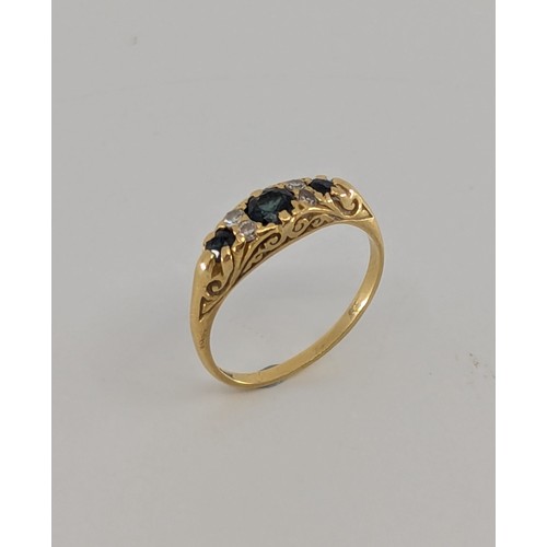 359 - An Art Deco sapphire and diamond dress ring, 
set with a central approx. 0.20ct round old cut dark g... 