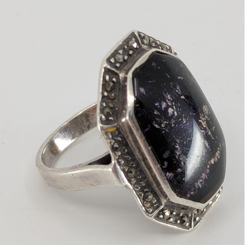 320 - A Blue John and marcasite set silver ring, 
set with a rectangular step cut shaped blue john piece m... 
