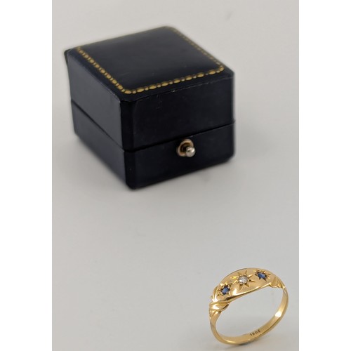 318 - A Victorian 18ct gold sapphire and diamond trilogy ring,
set with a central melee old European cut d... 