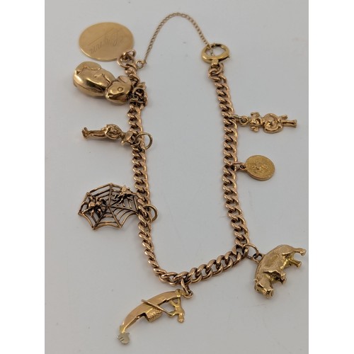 346 - A 9ct rose gold curb link charm bracelet,
the curb link charm bracelet stamped 