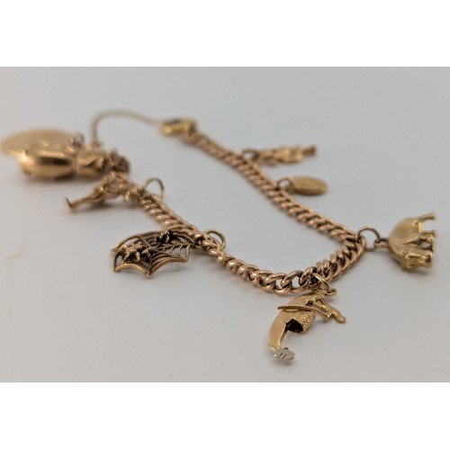 346 - A 9ct rose gold curb link charm bracelet,
the curb link charm bracelet stamped 