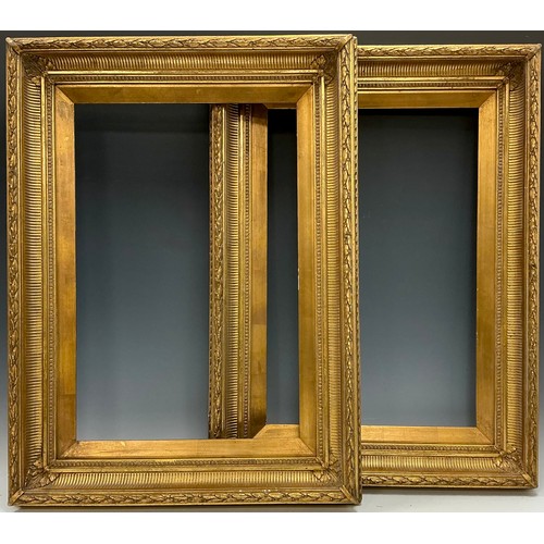 521 - A pair of 19th century fluted cove gilt frames, each measuring 41cm x 61.5cm at the aperture, and 61... 