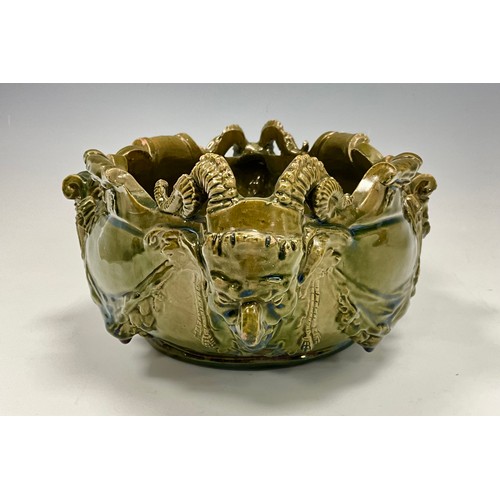 231 - A majolica glazed jardinière/centrepiece, likely by Delphin Massier, designed in the grotesque manne... 