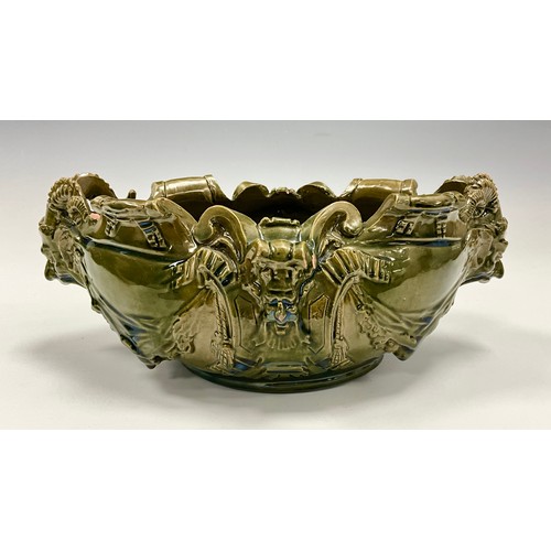 231 - A majolica glazed jardinière/centrepiece, likely by Delphin Massier, designed in the grotesque manne... 