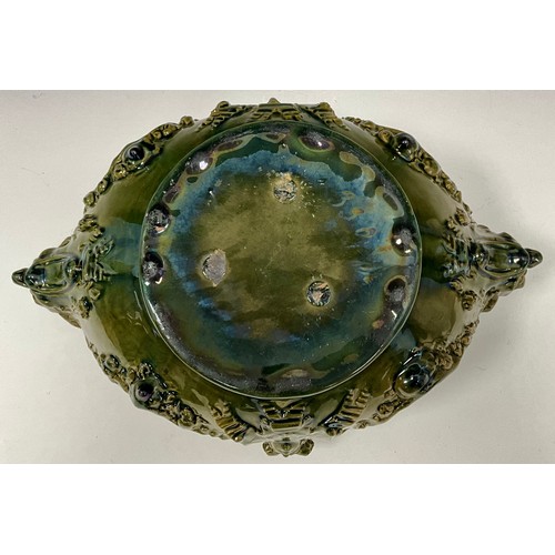 231 - A majolica glazed jardinière/centrepiece, likely by Delphin Massier, designed in the grotesque manne... 