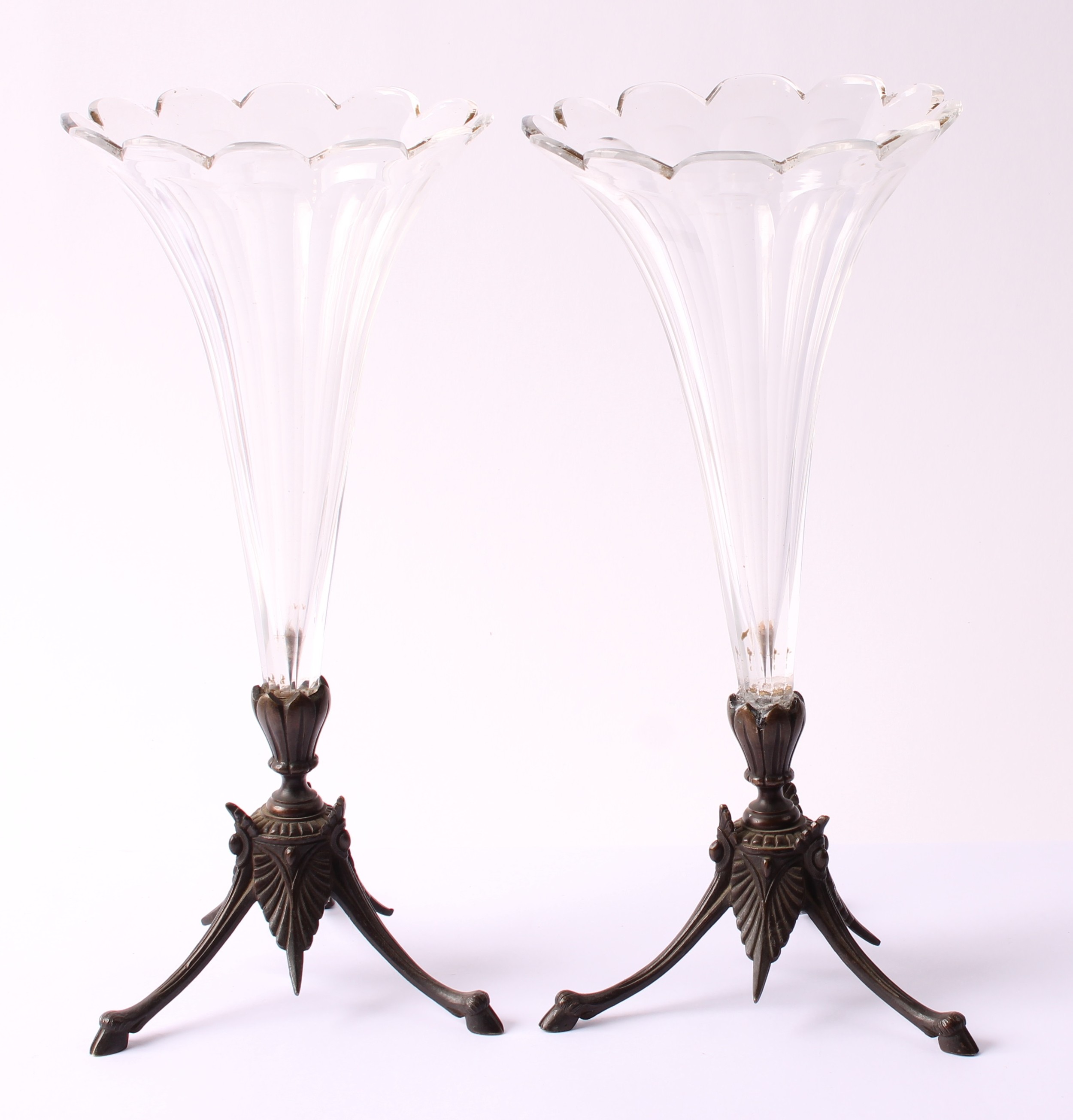 A pair of bronze and facet cut glass trumpet shaped mantle vases, petal ...