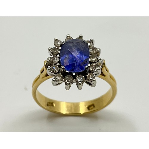 183 - An 18ct gold sapphire and diamond dress ring,
set with an approx. 1.60ct oval brilliant cut cornflow... 