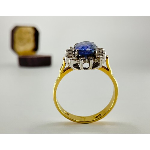 183 - An 18ct gold sapphire and diamond dress ring,
set with an approx. 1.60ct oval brilliant cut cornflow... 