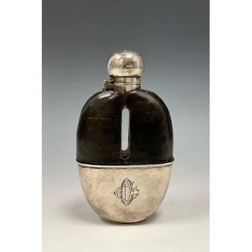 59 - A Victorian silver mounted hip flask, hinged domed bayonet cover, stirrup cup to base, 15cm long, Ja... 