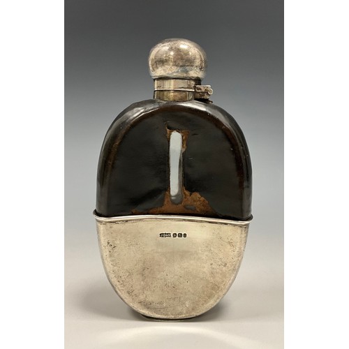 59 - A Victorian silver mounted hip flask, hinged domed bayonet cover, stirrup cup to base, 15cm long, Ja... 