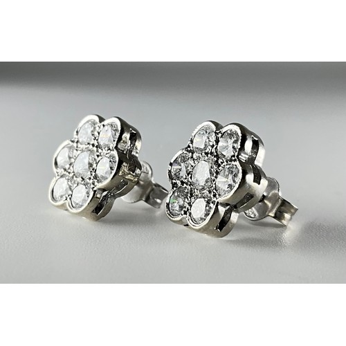 131 - A pair of 18ct white gold diamond cluster earrings, 
each earring set with a central approx. 0.15ct ... 