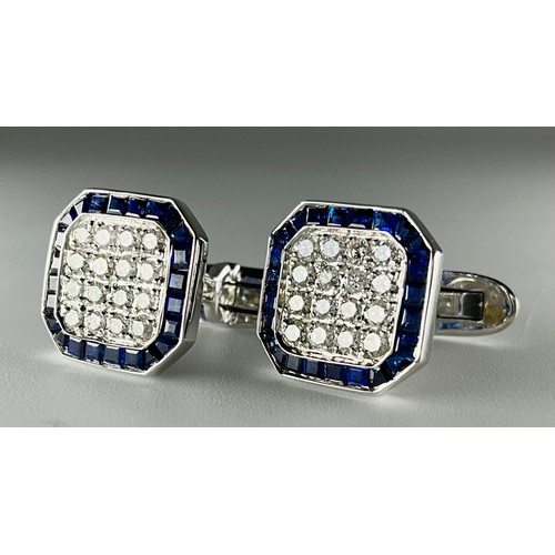132 - A pair of 18ct white gold sapphire and diamond set cufflinks, each cufflink set with sixteen approx.... 