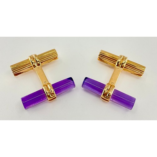136 - A pair of Boucheron 18ct gold amethyst set baton cufflinks, each cufflink set with a cabochon baton ... 