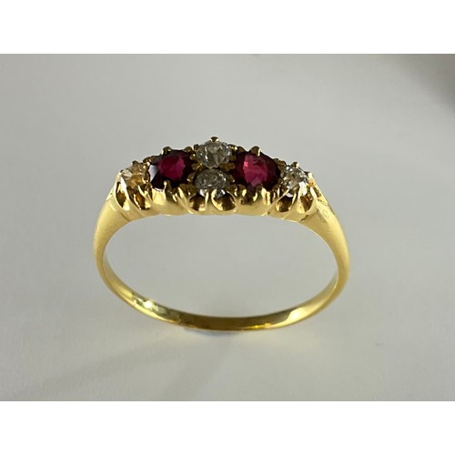 167 - A Victorian tested 18ct gold ruby and diamond ring,
set with two approx. 0.15ct cushion cut red rubi... 
