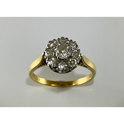 156 - A Victorian 18ct gold diamond cluster ring, 
set with a central old European cut diamond measuring a... 