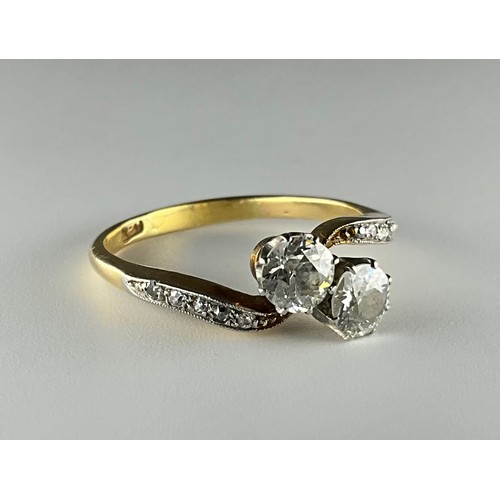 160 - A Victorian 18ct gold two stone Old European cut diamond with diamond shoulders ring,
set with an ap... 