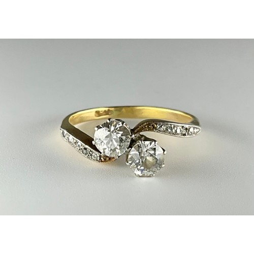 160 - A Victorian 18ct gold two stone Old European cut diamond with diamond shoulders ring,
set with an ap... 