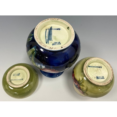 222 - A Moorcroft Orchids and Spring Flowers Pattern ovoid vase, signature and impressed mark to base, 13c... 