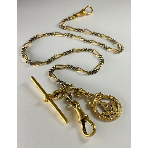 146 - A tested 18ct yellow and white gold figaro chain with t-bar, Grandmaster pendant, and an Albert dog ... 