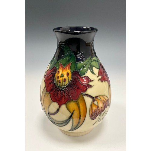 224 - A Moorcroft Anna Lily pattern ovoid shaped vase, marks to base, 19cm high.