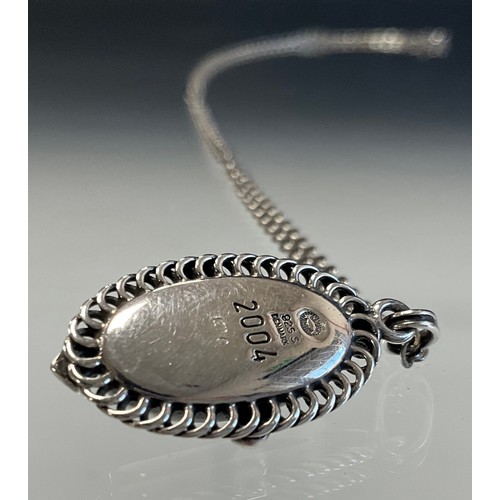 123 - A Georg Jensen black onyx set silver pendant, of the year 2004, with 