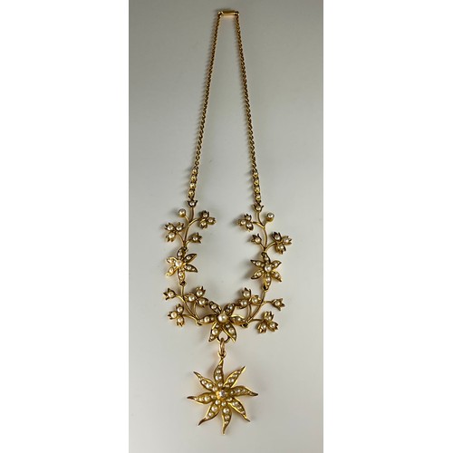 155 - A Victorian 15ct gold seed pearl and diamond necklace, 
set with seed pearls in a flower design, the... 