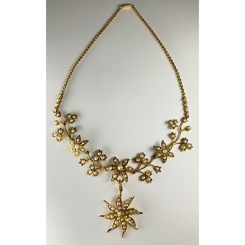 155 - A Victorian 15ct gold seed pearl and diamond necklace, 
set with seed pearls in a flower design, the... 