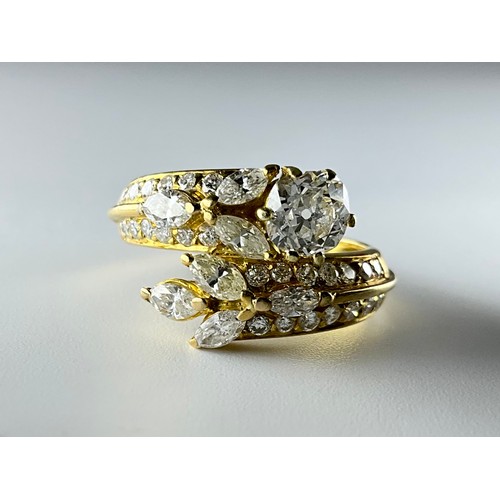 180 - An 18ct gold diamond set dress ring, set with a central approx. 0.75ct old mine cut diamond, diamond... 
