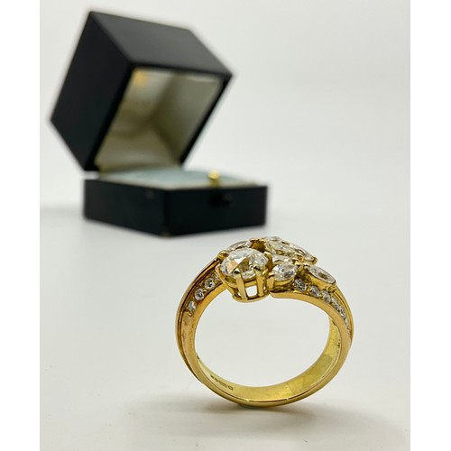 180 - An 18ct gold diamond set dress ring, set with a central approx. 0.75ct old mine cut diamond, diamond... 