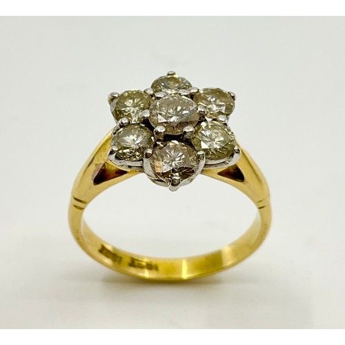 179 - An 18ct gold diamond daisy cluster ring,
set with a central approx. 0.30ct round brilliant cut diamo... 