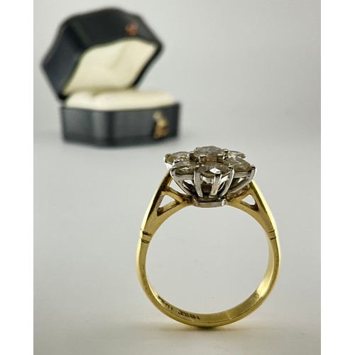 179 - An 18ct gold diamond daisy cluster ring,
set with a central approx. 0.30ct round brilliant cut diamo... 