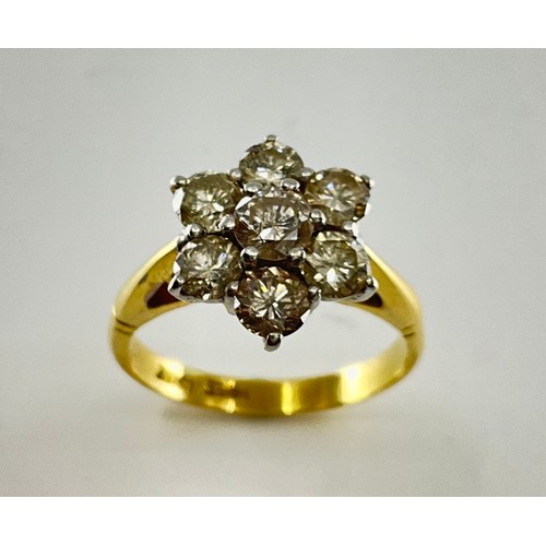 179 - An 18ct gold diamond daisy cluster ring,
set with a central approx. 0.30ct round brilliant cut diamo... 