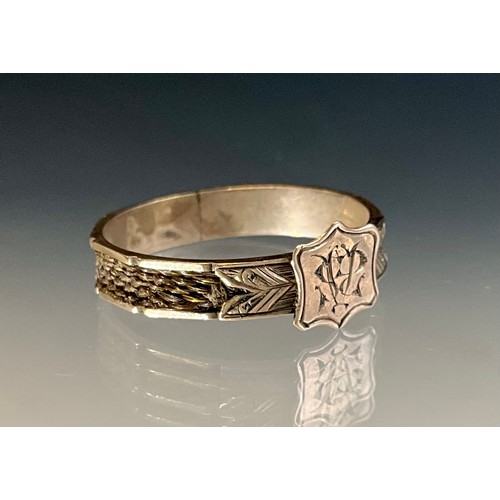 170 - A Victorian tested 9ct rose gold initialled woven hair mourning ring, 
initialled cartouche to the f... 