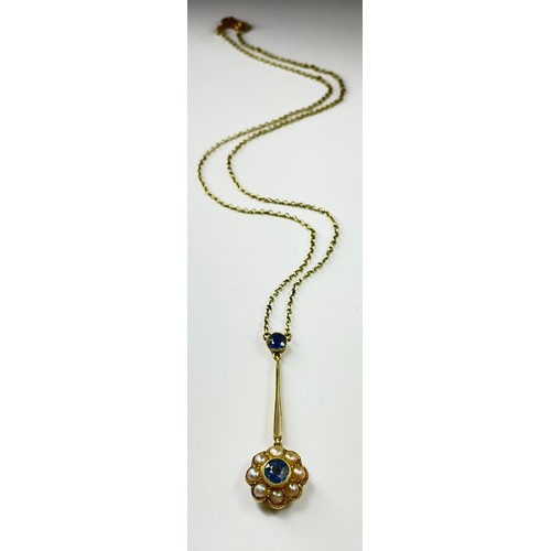 202 - An Art Nouveau 15ct gold sapphire and seed pearl pendant necklace, set with a round old cut cornflow... 