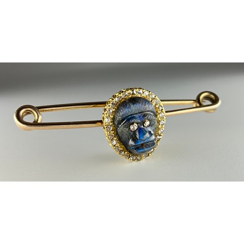 171 - A Victorian yellow and rose gold carved labradorite and diamond monkey mask brooch, the carved labra... 
